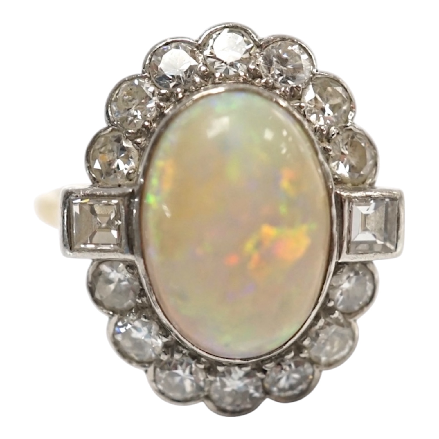 A mid 20th century 18ct, white opal, square and round cut diamond set oval cluster ring, size O, gross weight 3.3 grams. Condition - fair